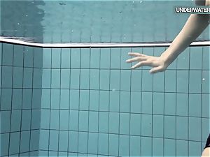 Loris blackhaired teenage swirling in the pool