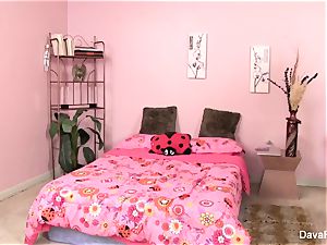 Dava and Lily Cade have fun on a pink bed